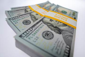 Money in 100 dollars. Money in dollar bills on paper concept. Money in dollar stacks on white isolated background. Money in USD dollar banknotes.