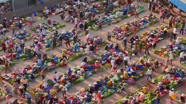 Aerial view of busy local daily life of the morning local market in Vi Thanh or Chom Hom market, Mekong Delta, Vietnam.
