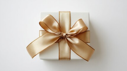 Gift box with ribbon sits alone on white, seen from above.