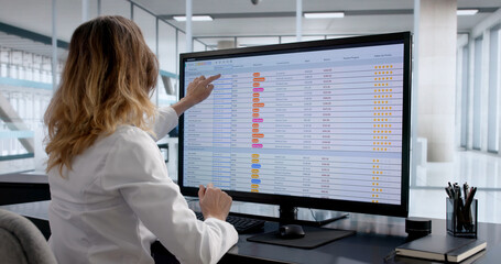 Female Chartered Accountant Analyzing Financial Data