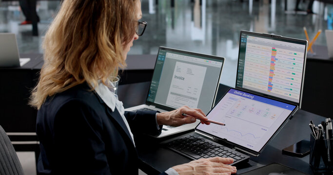 Woman Working At Office Desk, Using Online Banking App