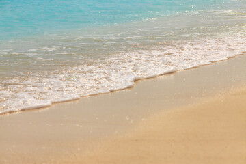 Golden sand meets gentle waves