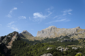 Rocky Mountain Range under Blue Summer Sky