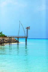 Fototapeta premium Calm turquoise waters meet clear blue sky