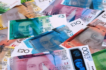 Gibraltar pound money bills pile on table. Gibraltar banknotes of GIP currency close up.