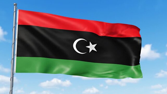 Flag of Libya waving proudly against a clear blue sky with white clouds.