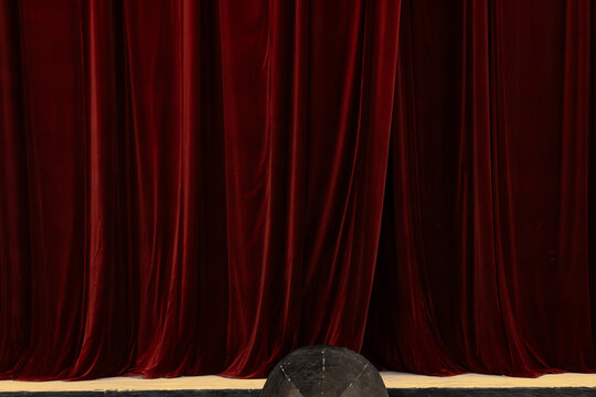 Vintage Prompter's Box on a Theater Stage in Front of Red Velvet Curtains