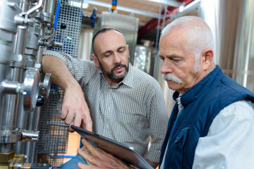 Fototapeta na wymiar senior man and colleague at a beer brewery