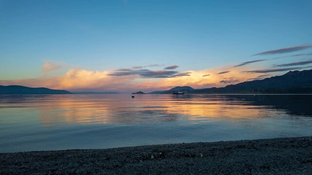 Golden Sunset Reflection On Calm Water Of Lake Bafa. High quality 4k footage