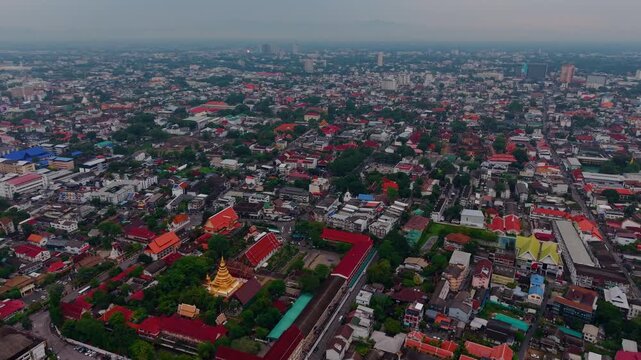 Aerial view golden Wat Phra Singh Woramahaviharn Temple, Buddhist pagoda in Chiang Mai, Thailand.