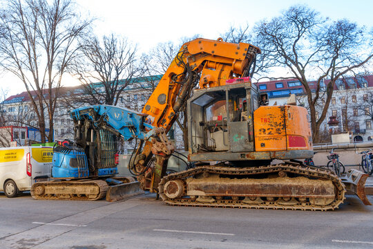 Vienna, Austria - February 24, 2026: Heavy Industrial Excavators Parked on Vienna Street for Roadwork