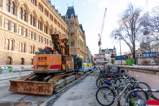 Vienna, Austria - February 24, 2026: Liebherr 924 Compact Excavator Parked Outside Vienna Rathaus City Hall