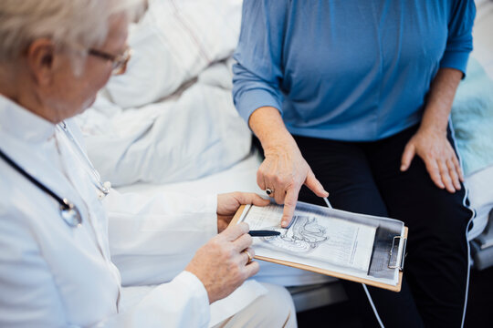 Doctor and patient discussing brain x-ray image during consultation