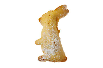 Bunny shaped cookie with powdered sugar on a white background for a festive celebration