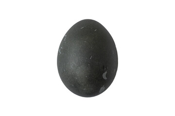 Black stone egg sitting on a white surface with a simple background and no other objects