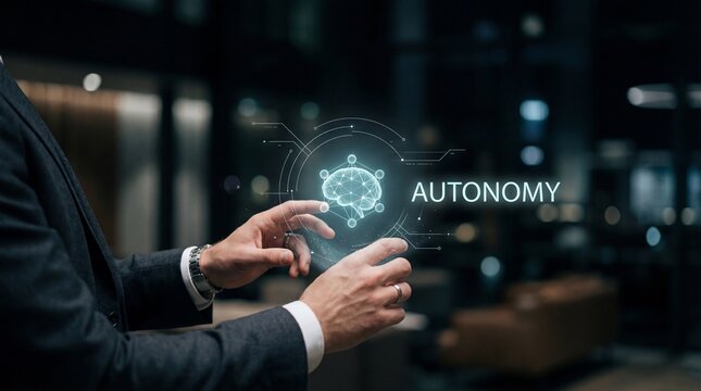 Agentic AI Systems: Businessman interacts with a holographic brain and 'AUTONOMY' text, representing agentic AI systems.