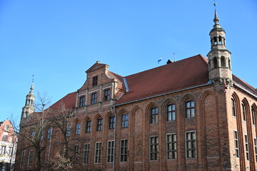 Obraz premium Facade tower and clock of historic town hall in Torun Poland 