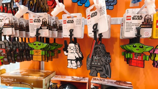 Lego Star Wars bag tags featuring Darth Vader Stormtrooper and Grogu characters hanging on a retail display rack in a toy store on December 26, 2025 in Bangkok, Thailand.