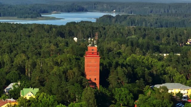 Panoramic drone shot around the water tower in Tammisaari, summer eve in Finland