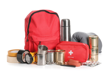 Red emergency backpack with necessities on white background