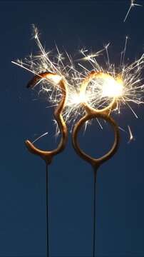 38 years celebration festive background made with Bengal fires in the form of number Thirty eight. Vertical video.