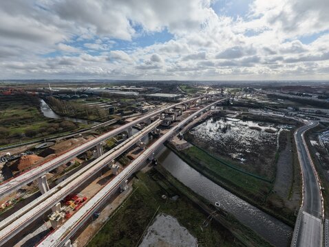 Aerial view of the HS2 railway construction site showing the viaduct spans stretching across the landscape near Gilson Road, Birmingham, United Kingdom.