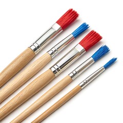 Fototapeta premium Set of paintbrushes with red and blue bristles on white background.