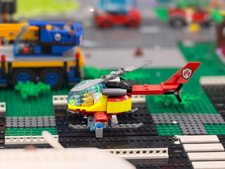 Naklejka premium Lego rescue helicopter on helipad
