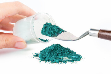 Prussian Blue, ultramarine pigment, dry paint on a white background, macro