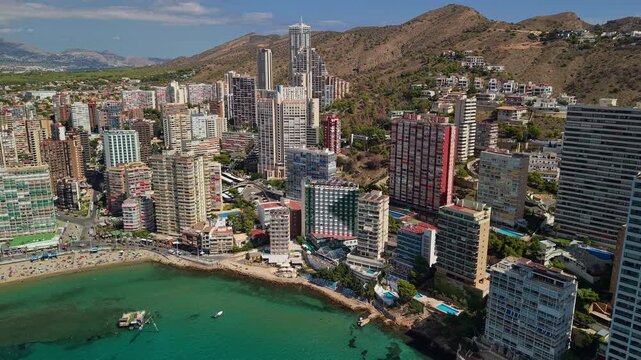 Aerial view of Benidorm coastal skyline with highrise buildings, Mediterranean bay and urban resort landscape Spain