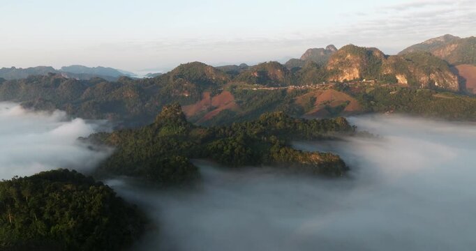 Sea Of Clouds Over Limestone Mountainscapes In Ban Ja Bo Lahu Village In Mae Hong Son, Thailand. Aerial Shot