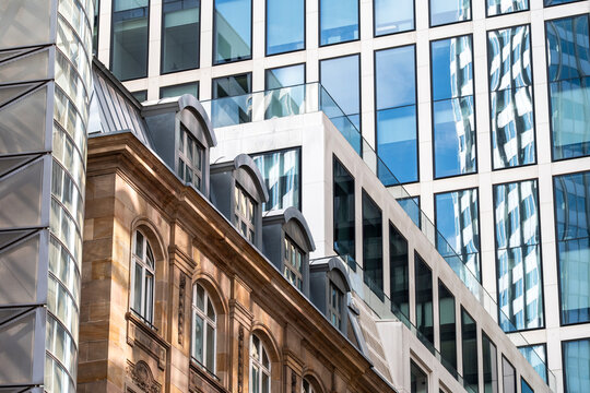 Architecture facade where modern glass meets historic contrast in the financial district of Frankfurt Germany creating a striking urban scene