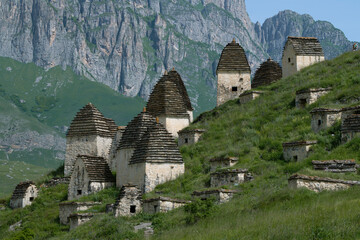 Ancient crypts of the City of the Dead in the mountains of Ossetia on a sunny June day. North Ossetia-Alania, Russian Federation