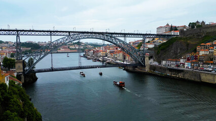 Fototapeta premium An aerial panorama view of the old town of the city Porto in Portugal beside Douro river on a sunny summer day.