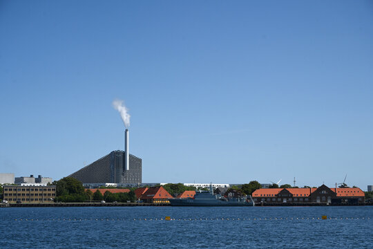 Copenhagen, Denmark - August 1, 2024: Amager Bakke, also known as Amager Slope or Copenhill, is a combined heat and power waste-to-energy plant and recreational facility in Copenhagen, Denmark.