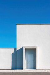 Minimalist modern building facade with recessed door and deep blue sky for design background poster and architectural banner