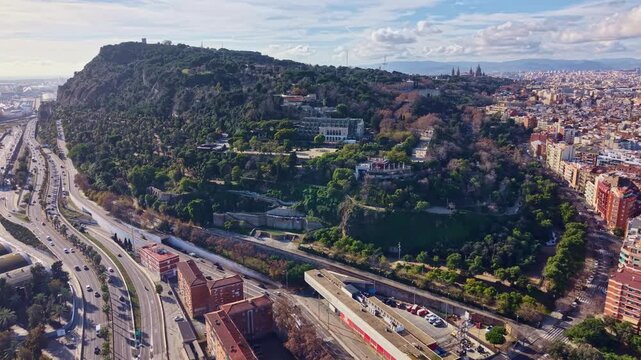 Montju&iuml;c hill landscape with Parc de Montju&iuml;c, Museu Nacional d&rsquo;Art de Catalunya and Avinguda del Paral&middot;lel visible, Barcelona, Catalonia autonomous community, Spain, slow push in.