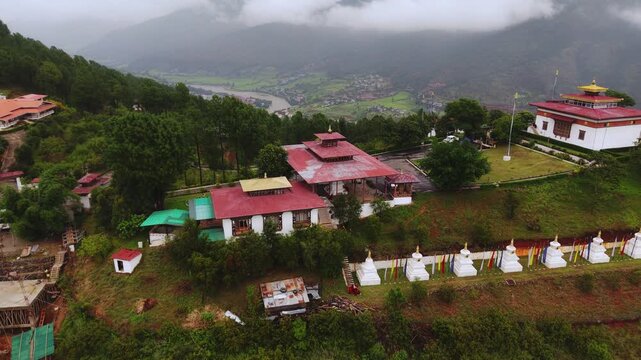 Walakha, Bhutan - 23 September 2025: Aerial view of Sangchhen Dorji Lhuendrup Lhakhang Nunnery, nestled amongst lush greenery and overlooking a valley.