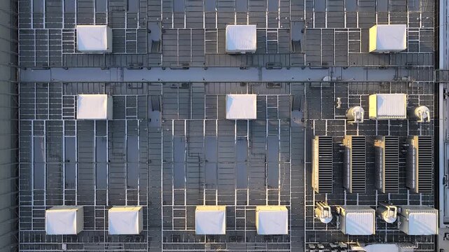 Aerial view of a modern data center building rooftop. Industrial cooling and ventilation systems with hvac units on a flat roof, Warszawa, Poland.
