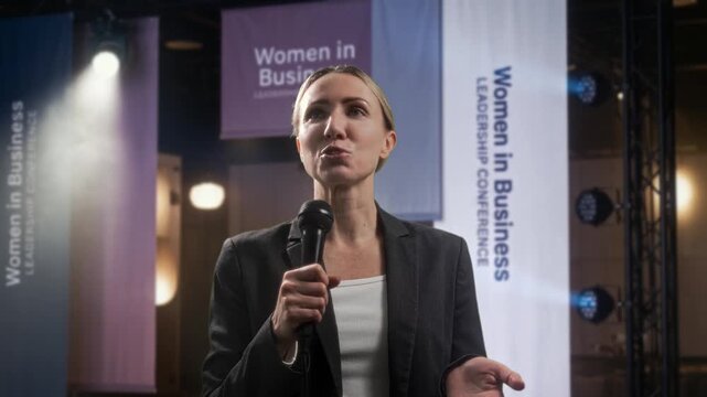 Mentorship Session Led By Inspiring Woman. Onstage Female Leader Shares Insights With Audience Present
