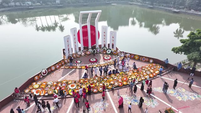 Aerial view of People place floral wreaths at the Shaheed Minar