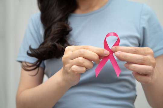 Asian woman with pink ribbon, World Breast Cancer Day at October.