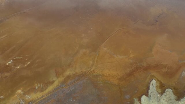 Aerial view of a landscape showing brown tones and textures, creating a unique and striking visual pattern, Minas de Riotinto, Andalusia, Spain.