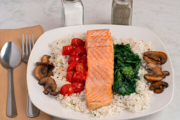baked salmon with  sauteed tomatoes, spinach and mushrooms