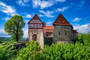 Fototapeta premium View of a small old castle in Germany. Bodenstein Castle is a medieval castle above the village of Wintzingerode, today part of Leinefelde-Worbis in the Eichsfeld district of Thuringia