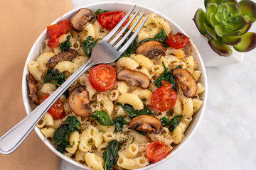  macaroni with sauteed mushrooms, tomatoes and spinach