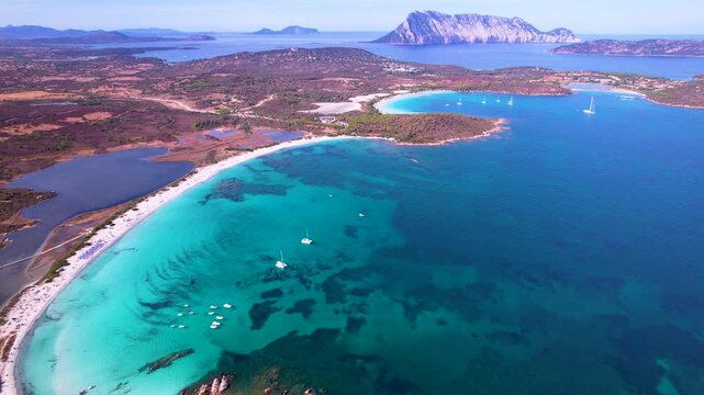 Breathtaking Sardinia Little Tahiti. Aerial 4K Cala Brandinchi and Lu Impostu. Tropical turquoise bays with white sand beaches from above. San Teodoro luxury paradise scenery.