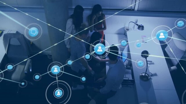 Animation of network of connections with icons over diverse business people in office