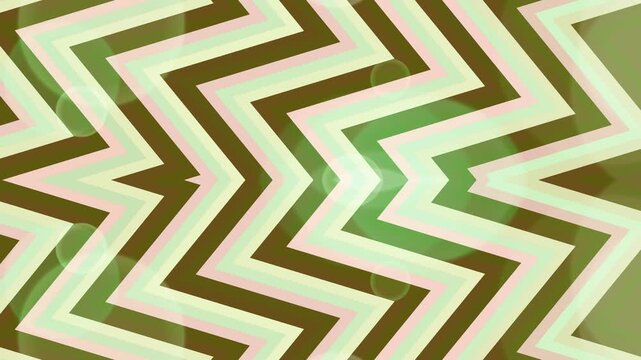 Geometric pattern with zigzag shapes in various green shades viewed straight