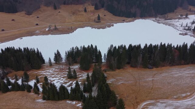 High angle view of frozen Geroldsee in winter. Located in Kruen Bavaria, the Wagenbruchsee is a premier destination for mountain tourism and nature video in Germany.
